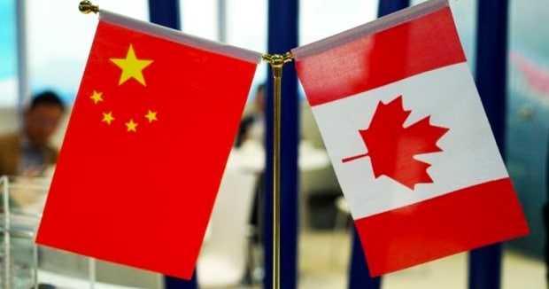 Chinese interference ‘systemic,’ report says as minister returns to Canada