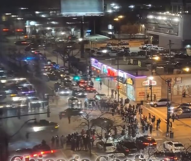 Tourists visiting Chicago confronted by nightmarish Mad Max scene unfolding outside hotel window