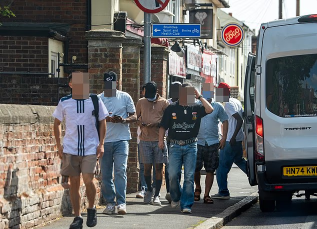 Inside the asylum centre ‘holiday camp’: A gym, football pitch, snack bar – and 17 minibuses to ferry migrants into towns.
