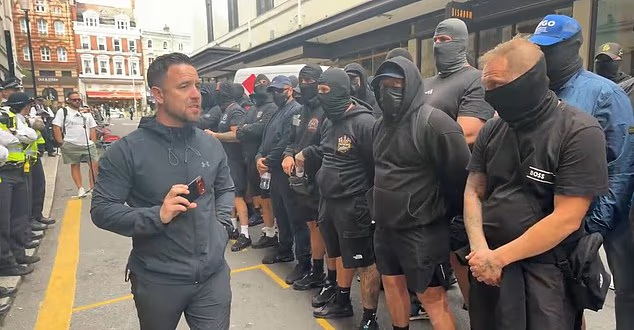 Balaclava-clad anti-migrant activists led by convicted criminal ‘Danny Tommo’ stage latest protest outside Daily Mail office