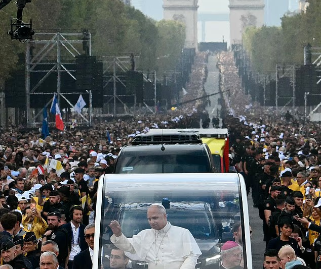 Pope Leo’s mass appeal: American pontiff is met by 600,000 crowd as he arrives for outdoor service in Paris before heading for Lourdes
