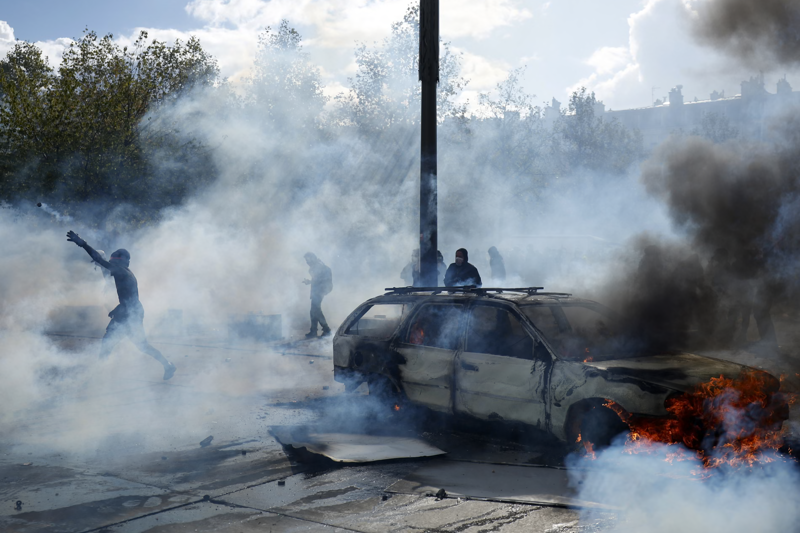 Police clash with protesters as tens of thousands take to streets across France